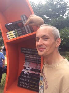 Graeme Cameron pointing to his book NORMAL